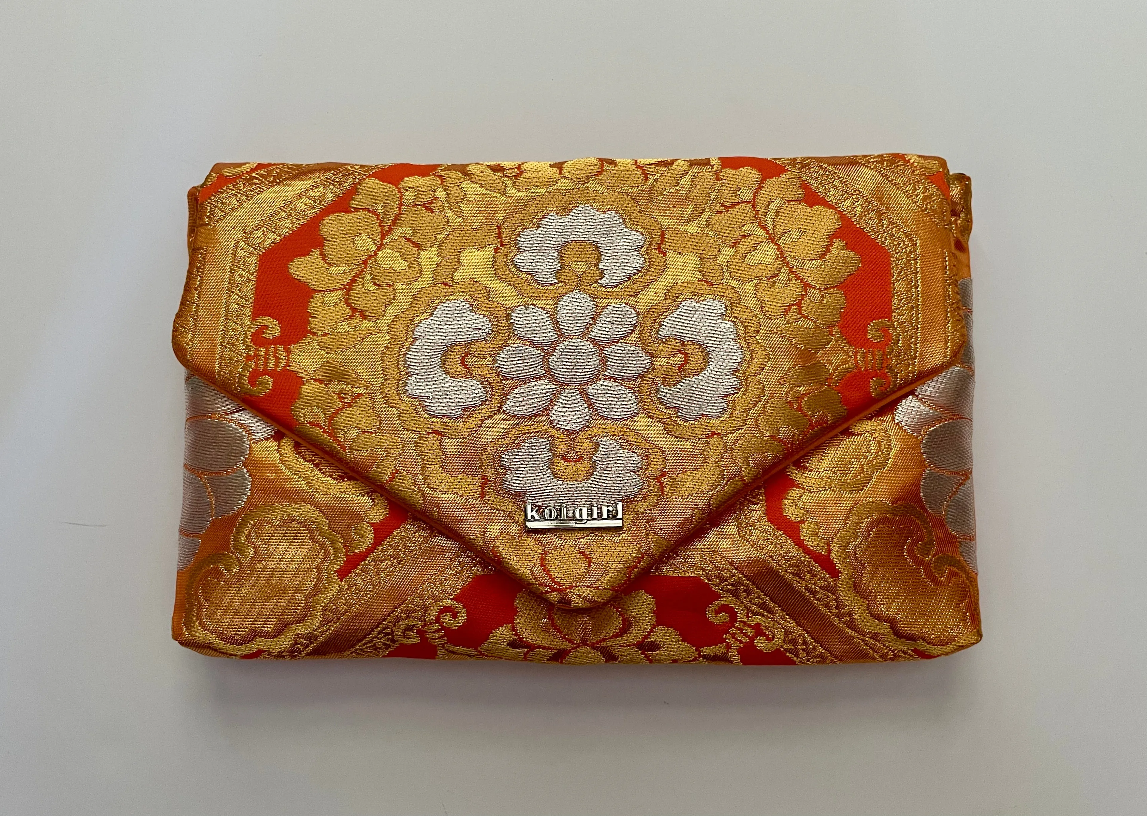 Salmon Pink Geometric Floral Clutch